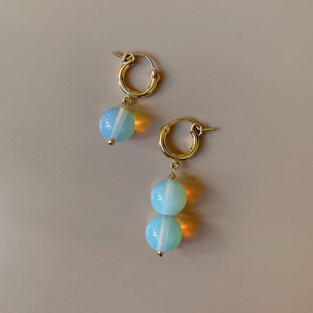 Orbit mismatched earrings